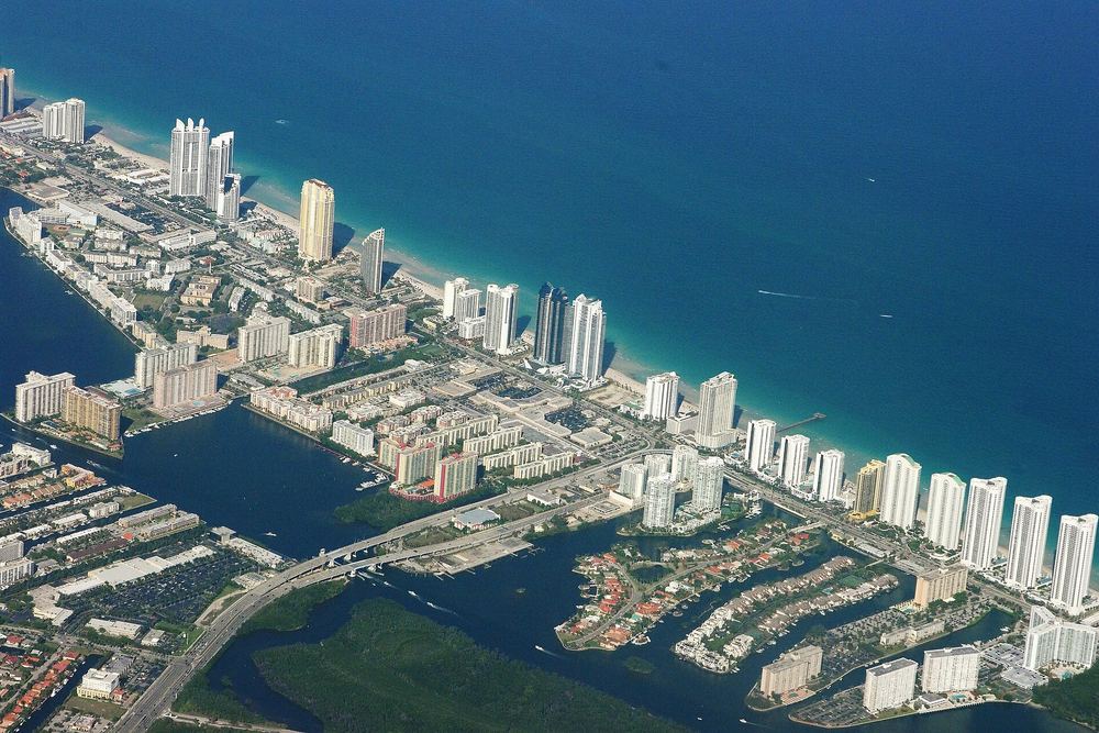 Sunny Isles Beach towers and shoreline from above
